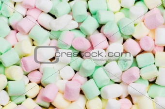 Various dry colourful sweets arranged as background