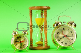 Time concept with clock and hour glass 