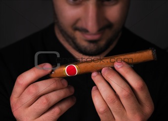 Man admiring cigar