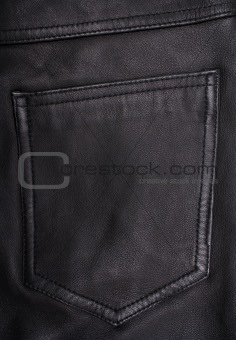 Pocket on the black leather texture as background 