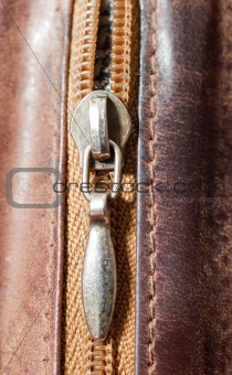 zipper on brown leather