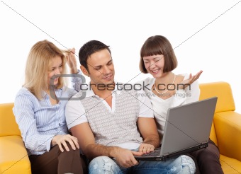 Happy young people with laptop computer