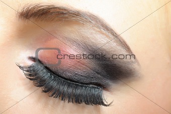elegant woman eye with dark make-up 