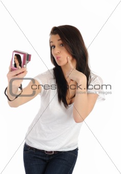 beautiful woman taking her own pictures on a digital camera