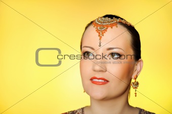 Young beautiful woman in indian traditional jewellery, bindi