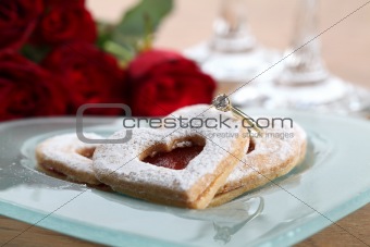 Gold engagement ring and shortbread hearts