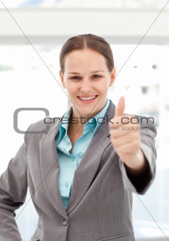 Happy businesswoman doing a thumbs up