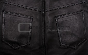 Pockets on the black leather texture