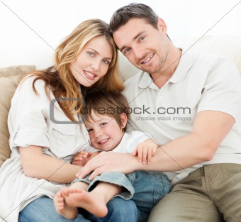 Happy family on their sofa