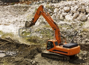 excavator during earthmoving works outdoors at construction site