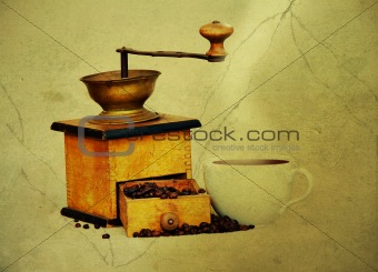 coffee mill and cup of hot black coffee