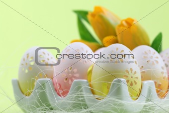 Flowery Easter eggs in an egg holder