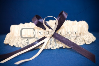 Wedding decor of blue garter with ribbon of lace lint