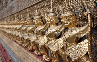 Golden figures warrior in royal palace