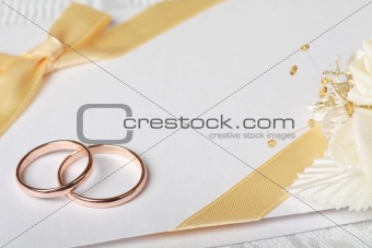 Wedding rings and wedding invitation 