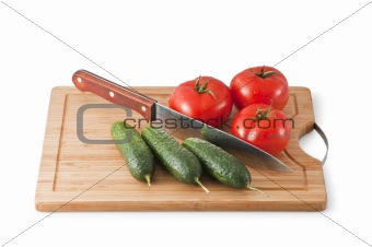 Cutting Board  with three tomatoes