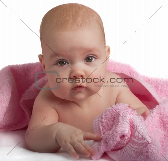 Cute baby with pink towel
