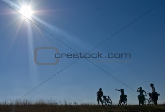 silhouettes of bicyclists