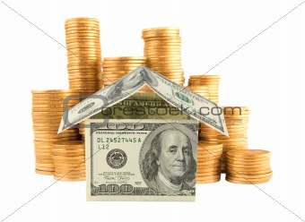 Many golden coins and dollar house isolated on white background