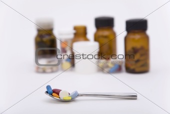 differently pills in spoon