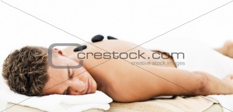 Young man enjoying spa treatment