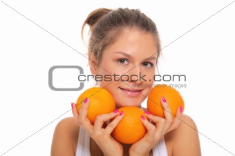 Beautiful smiling woman with oranges