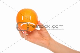 Hand holds orange with drawn insult