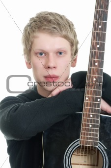 young handsome guy with a guitar.