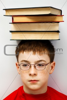 boy with a pile of books