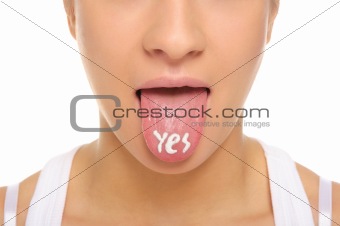 Woman puts out the tongue with an inscription yes