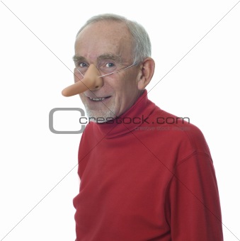 Old man wearing long false nose and smiling