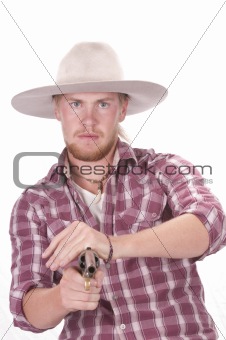 Cowboy fanning a single action revolver