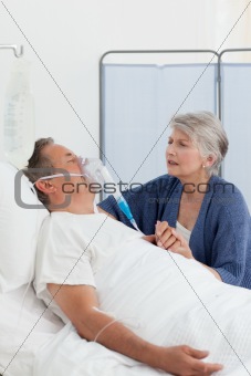 Old women taking care of her husband