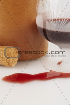 Glass  with wine, cork and bottle
