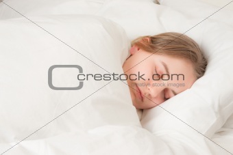 young woman asleep in bed