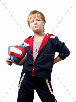 The cute little boy in a jumpsuit holds a ball