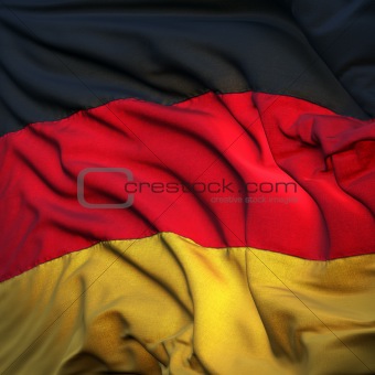 Flag of Germany, fluttering in the breeze, backlit rising sun