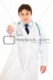Displeased medical doctor pointing fingers down
