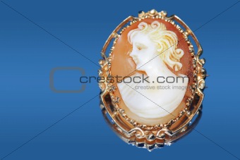 Antique cameo on blue