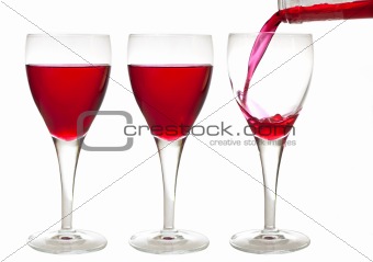 Three red liqueur drinks