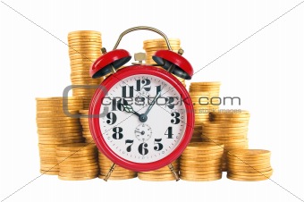 Alarm clock with golden coins on yellow background
