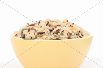 Yellow bowl with cooked rice of various types