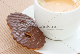Chocolate biscuits on saucer with coffee