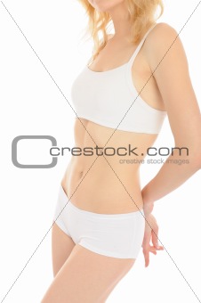 Part of beautiful fit slim woman body in white underwear.