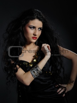 Beautiful woman with long black healthy hair in arabic tradition