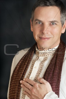 Man in Traditional Indian Clothing With Hand To Chest