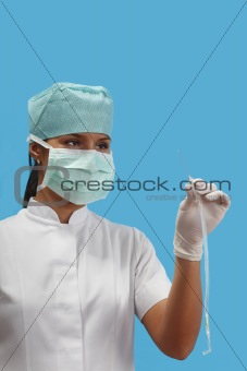 Nurse holding an arterial catheter