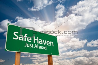 Safe Haven Green Road Sign with Dramatic Clouds, Sun Rays and Sky.