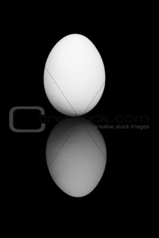 white egg on black