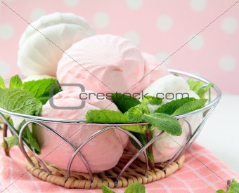 White and pink marshmallows with mint leaves